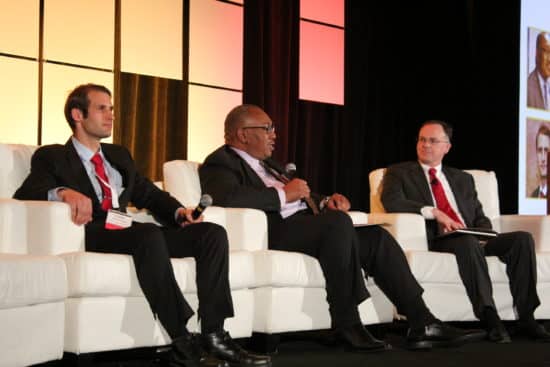 Colin Hector, attorney for the division of financial practices at the FTC, and Calvin Hagins, deputy assistant director for originations at the CFPB, discuss auto regulation on a panel moderated by John Redding, partner at Buckley Sandler LLP.