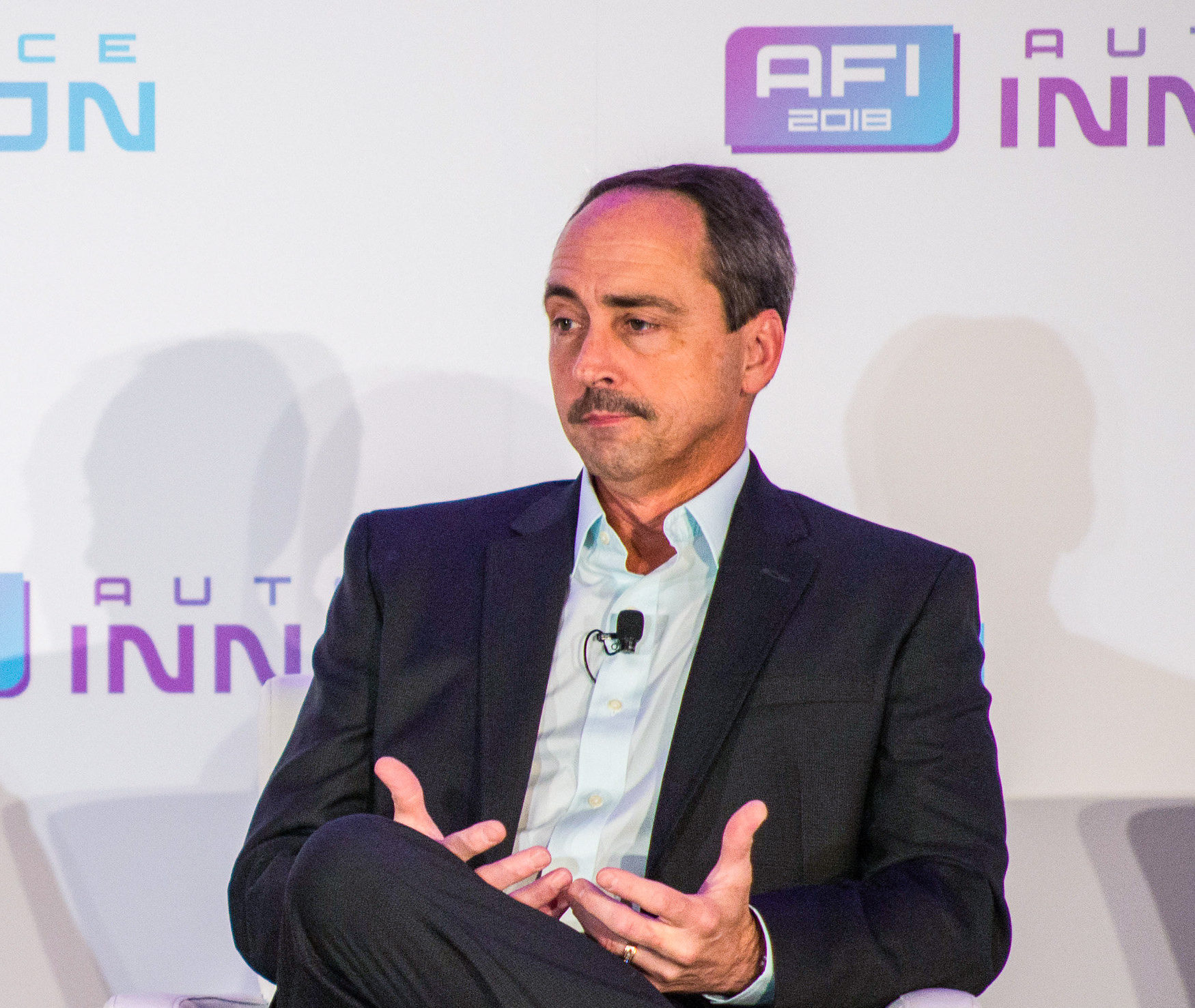 Larry Dominique, president and chief executive at Group PSA North America, sits down for a "fireside chat" at Auto Finance Innovation 2018 in San Francisco. (Photo by Lensology.net
