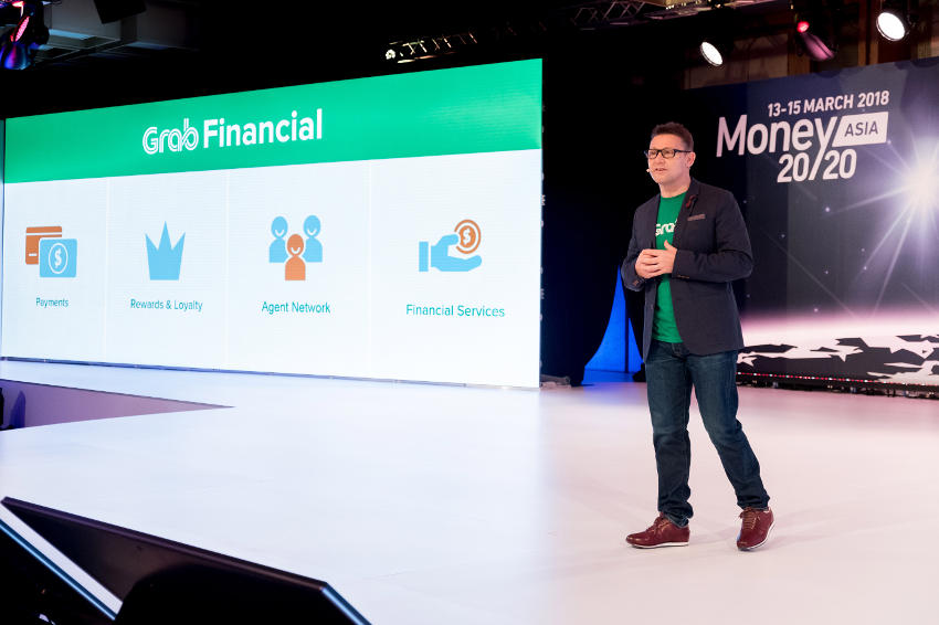 Head of GrabPay Southeast Asia Jason Thompson announces taht Grab wants to bring more visibility to financial services to its customers by offering micro-financing products and services at Money 20/20 in Singapore last week. (Photo by Grab)
