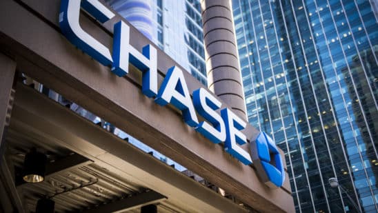 Signage is displayed outside a JPMorgan Chase & Co. bank branch stands in Chicago, Illinois, U.S., on Tuesday, July 10, 2017. JPMorgan Chase & Co. is scheduled to release earnings figures on July 13. Photographer: Christopher Dilts/Bloomberg