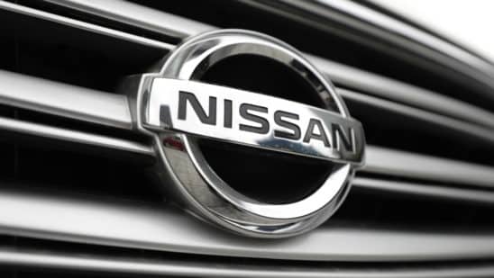 close up of nissan logo on vehicle