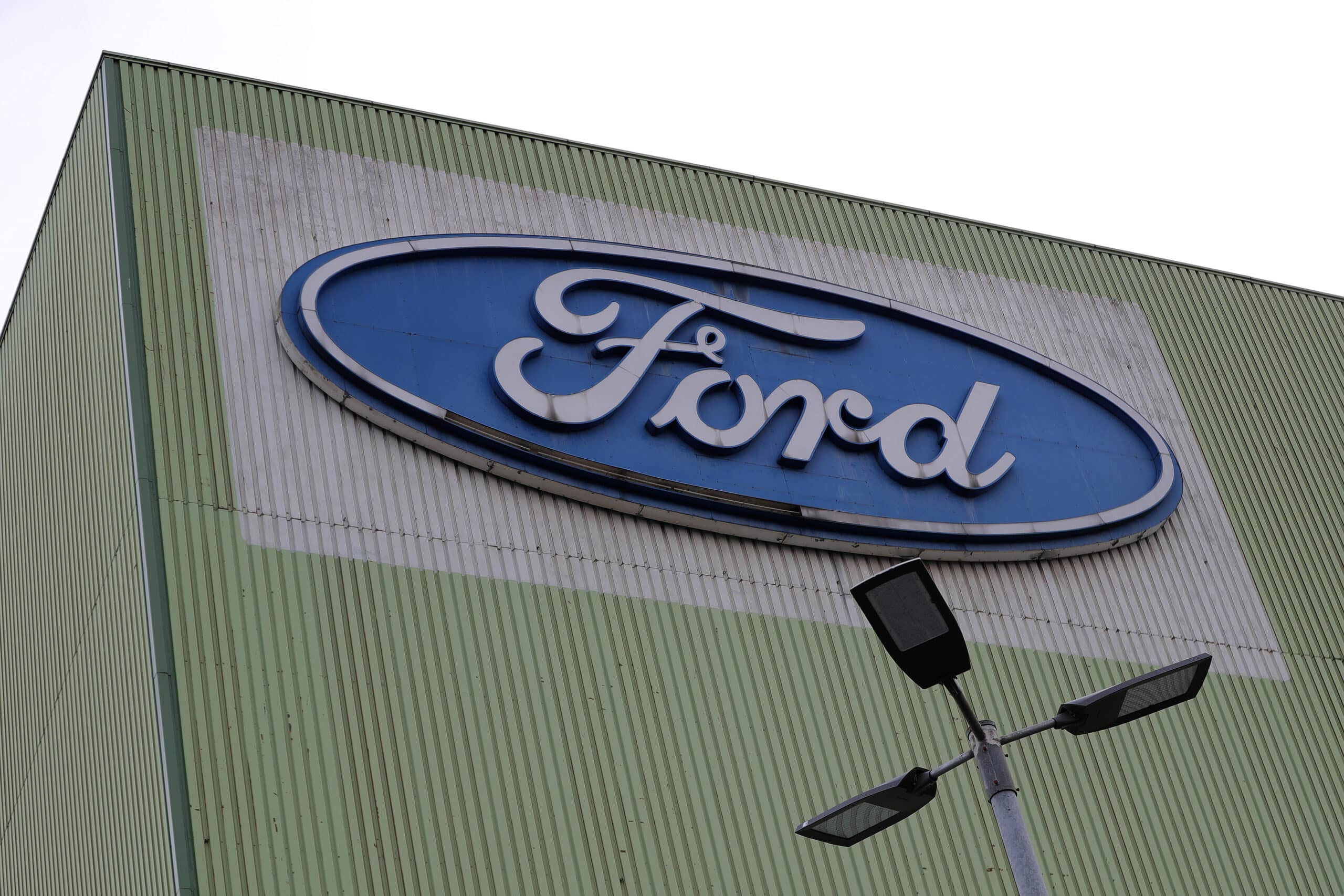 The Ford Motor Co. logo sits on the exterior of the automaker's factory in Cologne, Germany, on Wednesday, Feb. 13, 2019. Photographer: Krisztian Bocsi/Bloomberg