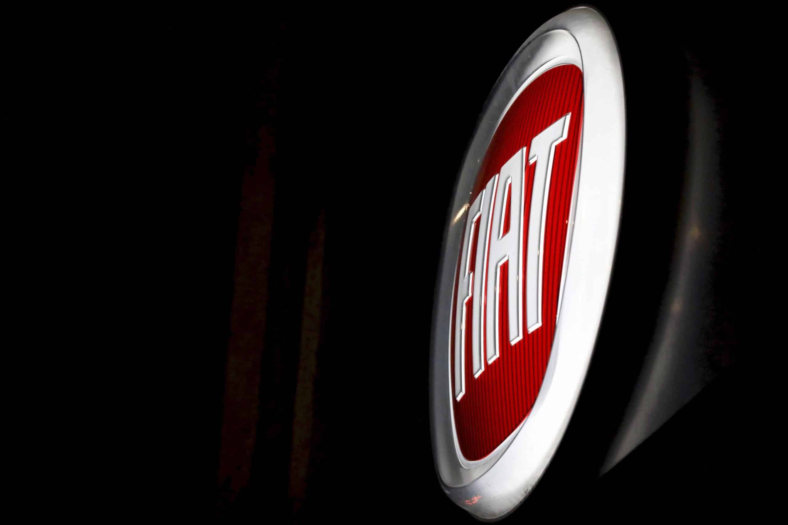 The Fiat Chrysler Automobiles (FCA) logo sits on the outside wall of one of the company's car dealerships in Rome, Italy, on Thursday, Oct. 31, 2019.  Photographer: Alessia Pierdomenico/Bloomberg