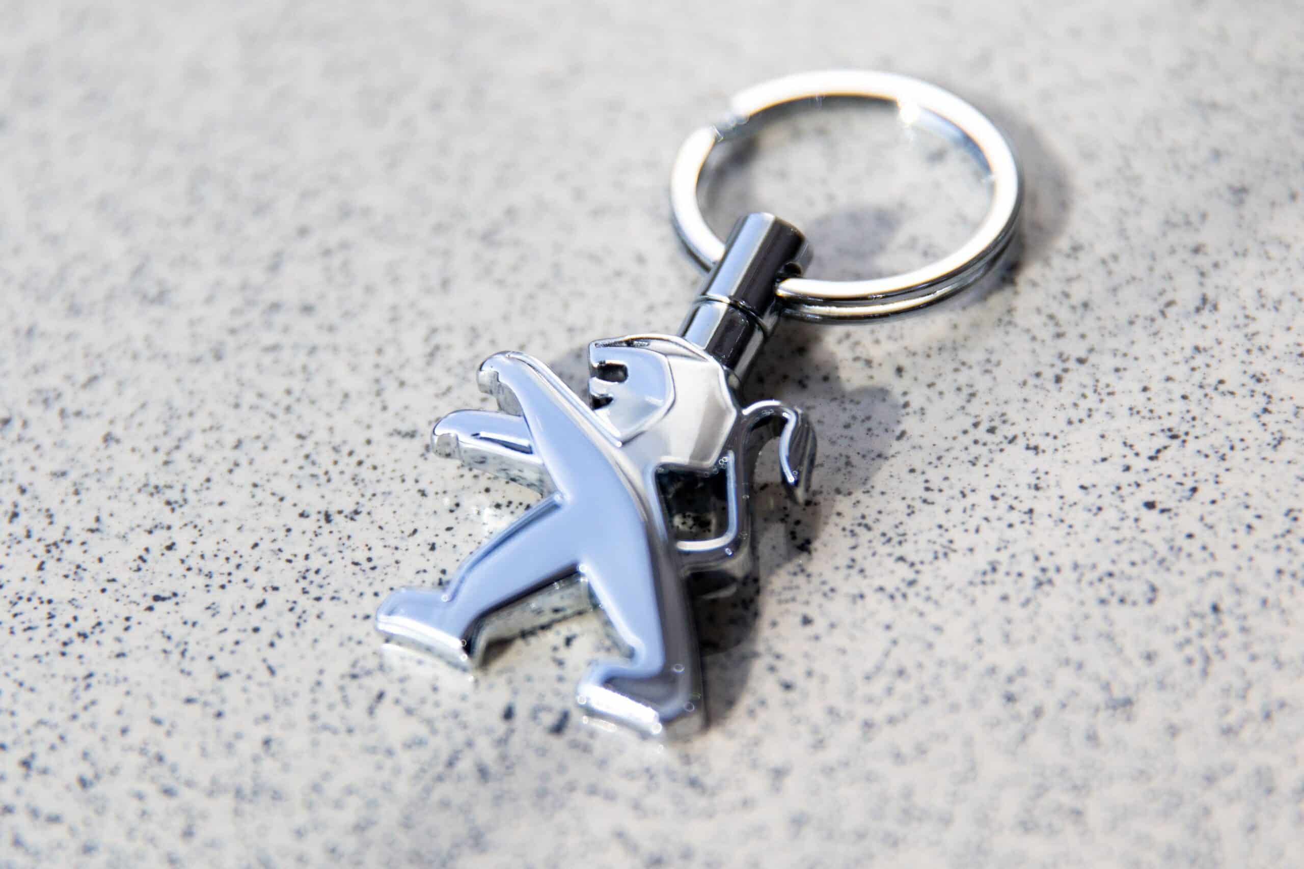 The logo of Peugeot is seen at the Al Naboodah showroom in Dubai, United Arab Emirates, on Thursday, Oct. 31, 2019. Photographer: Christopher Pike/Bloomberg