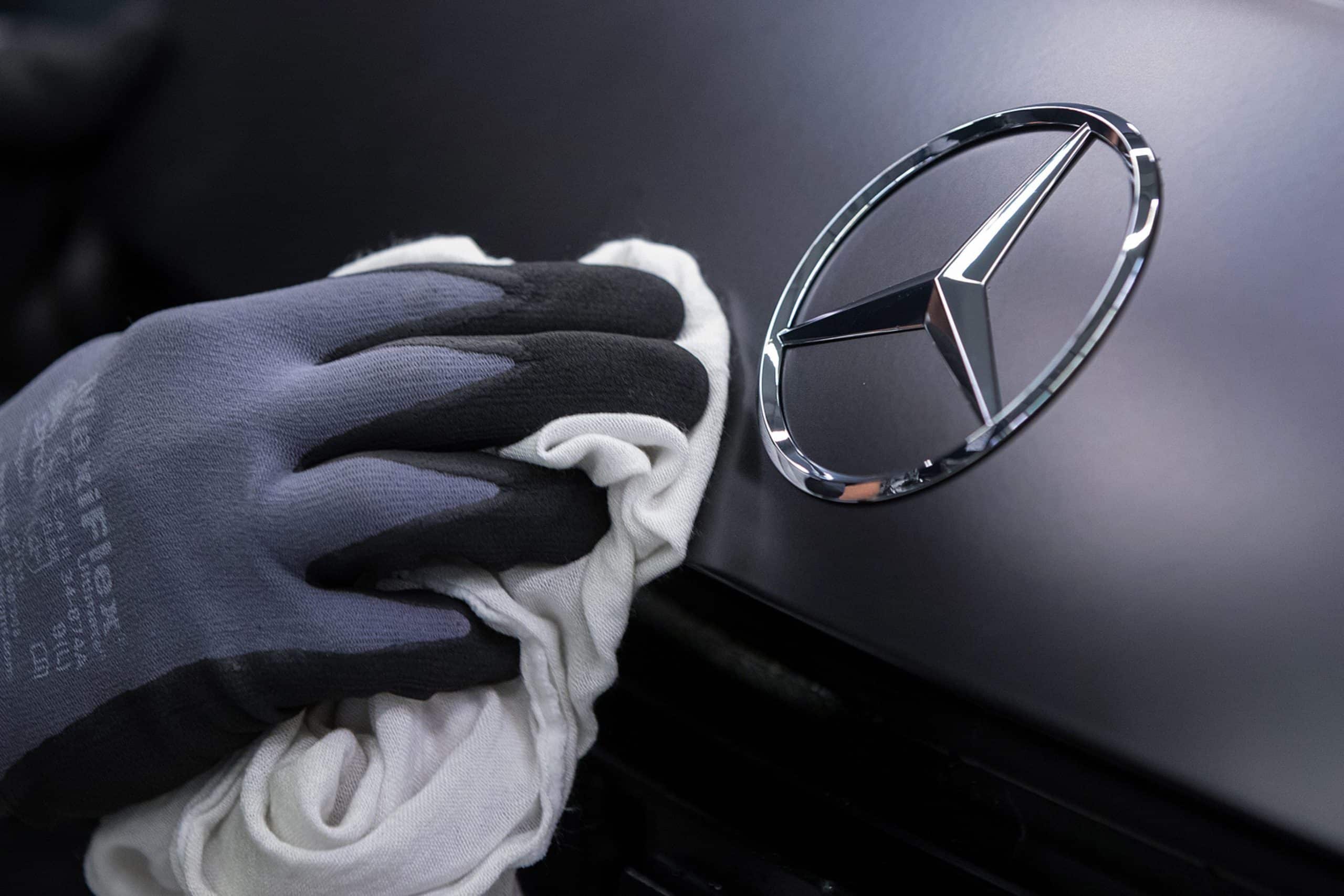 Mercedes AMG-GT manufacturing.Assembly line. Attaching the company's logo on the back of the car. Mercedes-Benz plant.Sindelfingen, Germany18.12.2017.Photo: Krisztian Bocsi