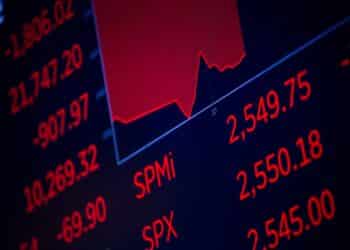 A monitor displays stock market information on the floor of the New York Stock Exchange (NYSE) in New York, U.S., on Thursday, March 12, 2020.