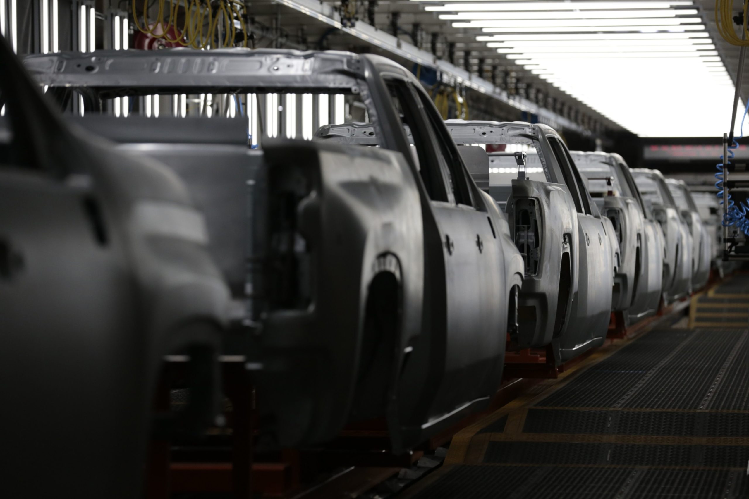 Pickup truck frames sit on the assembly line at the General Motors Co. plant in Flint, Michigan.