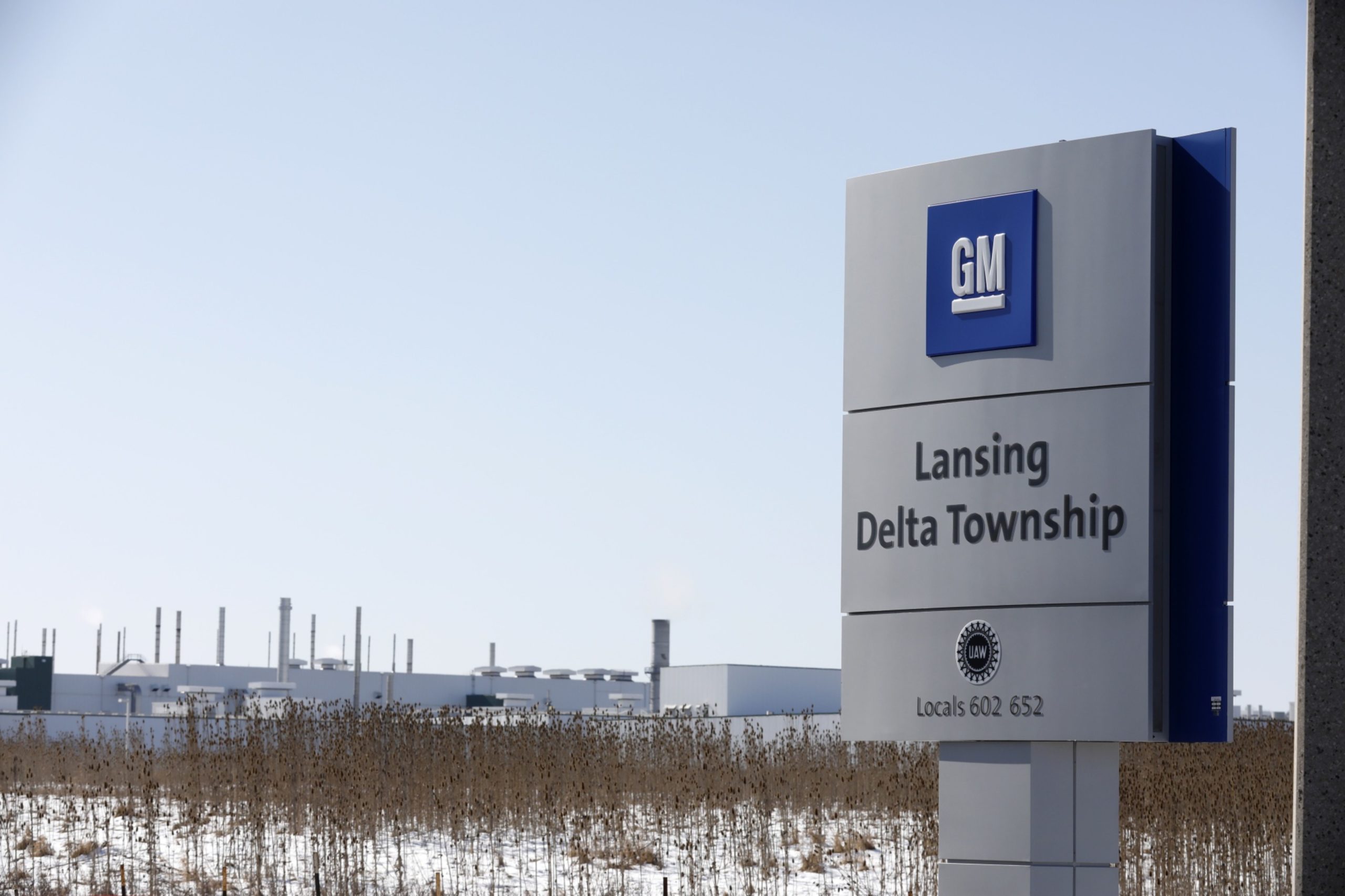 Signage is displayed outside the General Motors Co. Lansing Delta Township Assembly Plant stands in Lansing, Michigan, U.S., on Friday, Feb. 21, 2020.