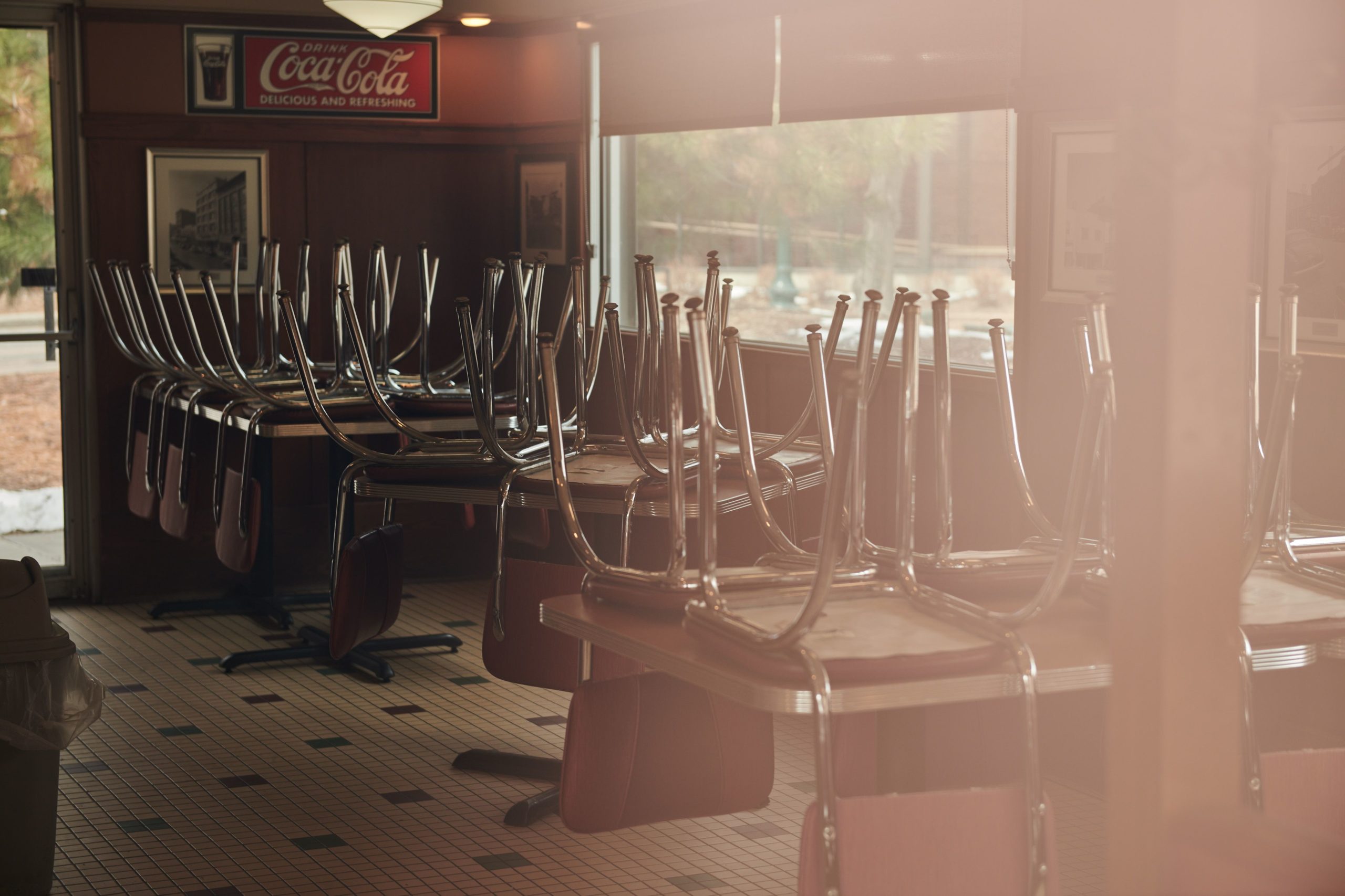 Chairs are stored on top of tables at a diner closed in Sioux Falls, South Dakota. Photographer: Dan Brouillette/Bloomberg