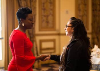 Renee Horne, vice president of consumer lending experiences, meets with an attendee at the 2019 Auto Finance Summit after her presentation at the Women in Auto Finance Luncheon