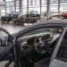 car in dealership showroom with bow on top