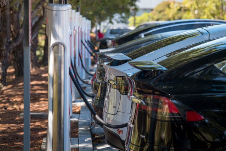tesla charging station with EVs