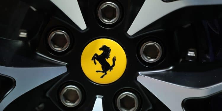 Ferrari posts steady profit before outsider CEO takes helm