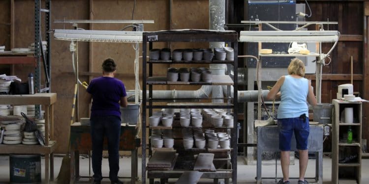 Factory output in U.S. rises less than forecast, dented by Ida