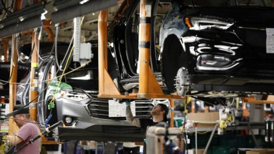 Auto forecaster slashes outlook by most since chip woes emerged