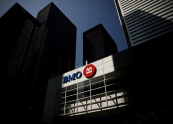 Bank of Montreal (BMO) signage is displayed on a building in the financial district of Toronto, Ontario, Canada, on Thursday, July 25, 2019. Canadian stocks fell as tech heavyweight Shopify Inc. weighed on the benchmark and investors continued to flee pot companies. Photographer: Brent Lewin/Bloomberg