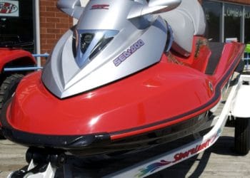 A SeaDoo watercraft sits outside a dealer in Lombard, Illinois on Wednesday, August 27, 2003. SeaDoo parent company Bombardier Inc., the world's third- biggest maker of commercial jets, agreed to sell its snowmobile and boat unit for C$1.23 billion ($880 million) to a group that includes the founder's family and Bain Capital LLC, taking another step to preserve the company's credit rating.   Photographer: Tannen Maury/Bloomberg News