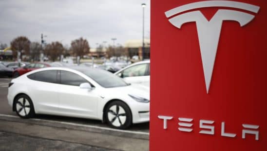 Tesla Inc. signage outside a dealership at the Easton Town Center shopping mall in Columbus, Ohio, U.S., on Friday, Dec. 10, 2021.
