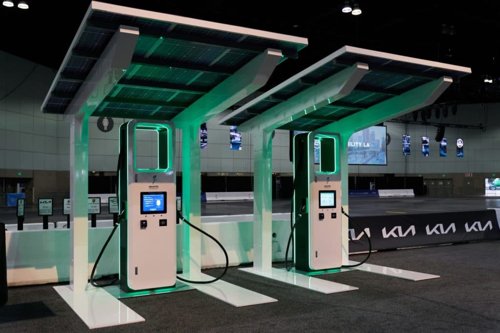 Electrify America electric vehicle (EV) charging stations on display at AutoMobility LA ahead of the Los Angeles Auto Show in Los Angeles, California, U.S., on Thursday, Nov. 18, 2021. Covid-19 canceled the Los Angeles Auto Show in 2020 and now that the show is back, some automakers have decided they didn't need it anyway.