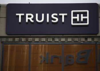 Signage outside a Truist Financial Corp. bank branch in Lexington, Kentucky, U.S., on Sunday, Jan. 16, 2022. Truist Financial reported adjusted earnings per share for the fourth quarter that beat the average analyst estimate.