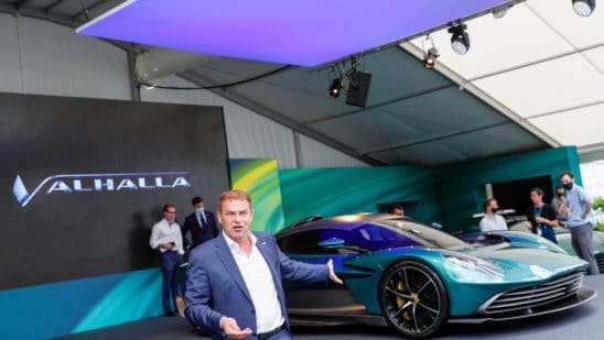 Tobias Moers, chief executive officer of Aston Martin Lagonda Global Holdings Plc, speaks during the reveal of the Valhalla plug-in hybrid supercar, manufactured by Aston Martin Lagonda Global Holdings Plc, in Silverstone, U.K., on Thursday, July 15, 2021. The 950-horsepower plug-in hybrid, boasting futuristic lines and a distinct front, will be the middle child of Aston Martin's mid-engine sports car line, priced below the 2.5 million-pound ($3.5 million) Valkyrie and above the Vantage.