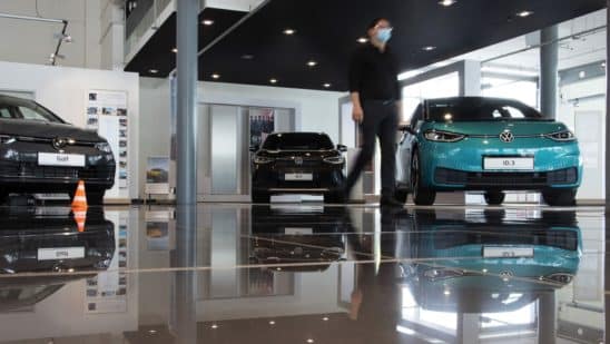 A VW showroom in Berlin featuring several electric models.