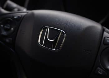 The Honda badge is displayed on the steering wheel of a vehicle at the company's showroom in Tokyo. Photographer: Kiyoshi Ota/Bloomberg