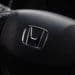 The Honda badge is displayed on the steering wheel of a vehicle at the company's showroom in Tokyo. Photographer: Kiyoshi Ota/Bloomberg