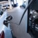 A Mercedes-Benz EQC electric vehicle connected to a charger inside a Mercedes-Benz AG showroom in Berlin, Germany