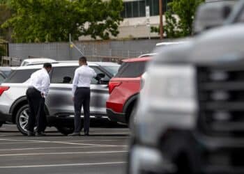 Customers view a vehicle for sale at a Ford Motor Co. dealership in Richmond, California, U.S., on Thursday, July 1, 2021. The global semiconductor shortage that hobbled auto production worldwide this year is leaving showrooms with few models to showcase just as U.S. consumers breaking free of pandemic restrictions are eager for new wheels.