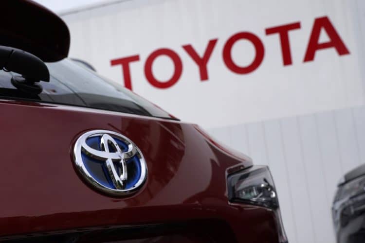 A Toyota Motor Co. badge is seen on a Corolla Touring wagon displayed outside a dealership in Tokyo, Japan, on Sunday, May 10, 2020. Global automakers and suppliers are on track to get at least $100 billion of bank financing as the coronavirus pandemic hammers car sales. Photographer: Toru Hanai/Bloomberg