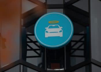 A logo at a Carvana Vending Machine location in Novi, Michigan, U.S., on Wednesday, Nov. 3, 2021. Hertz Global Holdings Inc., fresh off a blockbuster order for 100,000 Teslas, reached an exclusive agreement to supply Uber drivers with electric vehicles and signed up Carvana Co. to dispose of rental cars it no longer wants. 