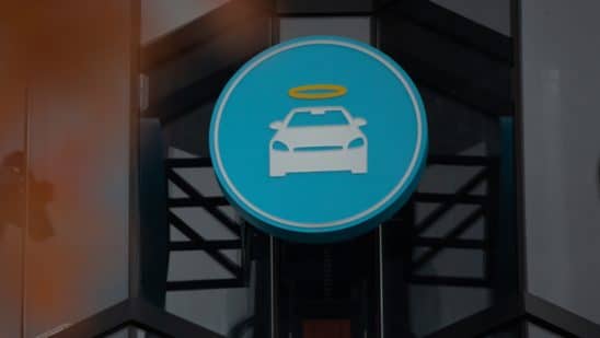 A logo at a Carvana Vending Machine location in Novi, Michigan, U.S., on Wednesday, Nov. 3, 2021. Hertz Global Holdings Inc., fresh off a blockbuster order for 100,000 Teslas, reached an exclusive agreement to supply Uber drivers with electric vehicles and signed up Carvana Co. to dispose of rental cars it no longer wants. 