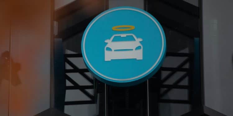 A logo at a Carvana Vending Machine location in Novi, Michigan, U.S., on Wednesday, Nov. 3, 2021. Hertz Global Holdings Inc., fresh off a blockbuster order for 100,000 Teslas, reached an exclusive agreement to supply Uber drivers with electric vehicles and signed up Carvana Co. to dispose of rental cars it no longer wants. 