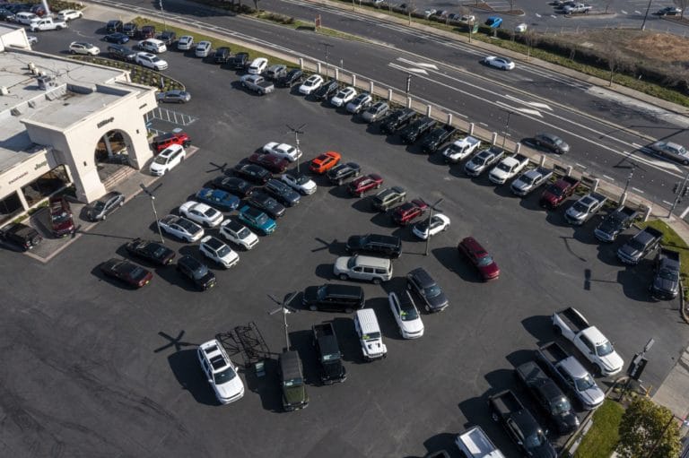 A General Motors GMC Buick dealership in Richmond, California, U.S., on Wednesday, Jan. 26, 2022. U.S. auto sales will climb just 3.4% this year to 15.4 million cars and trucks as the semiconductor shortages continue to constrain vehicle inventory, auto dealers predict. Photographer: David Paul Morris/Bloomberg