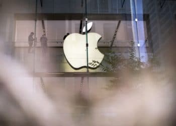 The Apple Inc. logo at one of the company's stores in Sydney, Australia, on Friday, March 18, 2022. The debut of Apple's latest iPhone brings a change to the way its U.S. customers can purchase the device, a move toward cutting wireless carriers out of the process and giving the tech giant more control. Photographer: Brent Lewin/Bloomberg