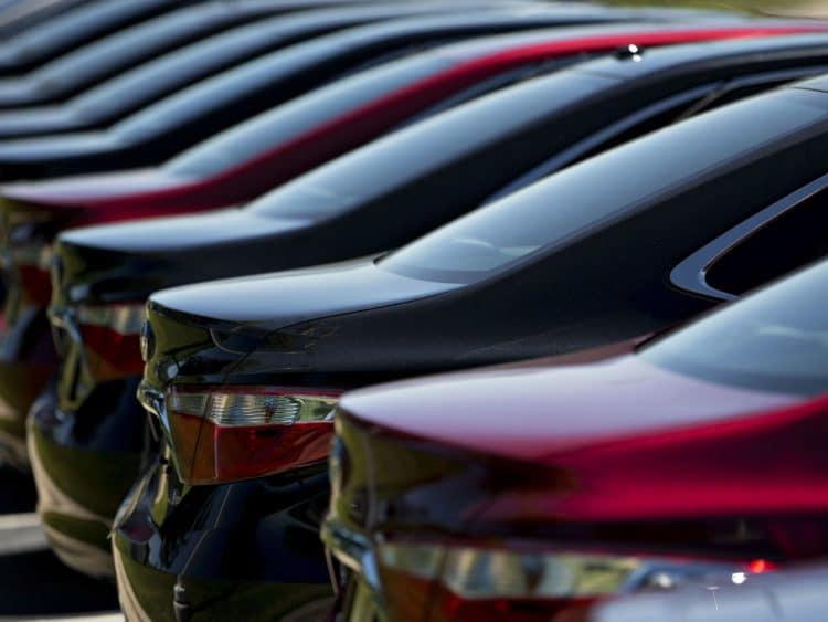 A row of 2016 Toyota Motor Corp. Camry vehicles sit on display for sale on the lot of the Peoria Toyota Scion car dealership in Peoria, Illinois, U.S.