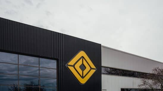 A logo outside the Rivian manufacturing facility in Normal, Illinois, US., on Monday, April 11, 2022. Rivian Automotive Inc. produced 2,553 vehicles in the first quarter as the maker of plug-in trucks contended with a snarled supply chain and pandemic challenges.