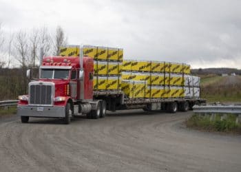 A truck loaded with boxes containing Ski-Doo brand snowmobiles leaves a BRP manufacturing facility in Valcourt, Quebec, Canada, on Wednesday, Oct. 28, 2020. BRP Inc. says production shutdowns depleted its inventory and dragged down revenues in its second quarter, but rising demand buoyed profits as fun-seekers turned to power sports for pandemic recreation, The Toronto Star reported. Photographer: Christinne Muschi/Bloomberg