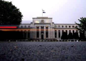 A vehicle passes by the Marriner S. Eccles Federal Reserve building in Washington, D.C. Photographer: Stefani Reynolds/Bloomberg