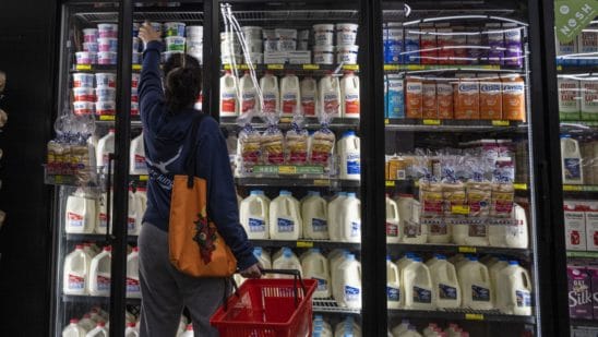 A shopper reaches for cottage cheese inside a grocery store in San Francisco, California, U.S., on Monday, May 2, 2022. U.S. inflation-adjusted consumer spending rose in March despite intense price pressures, indicating households still have solid appetites and wherewithal for shopping.