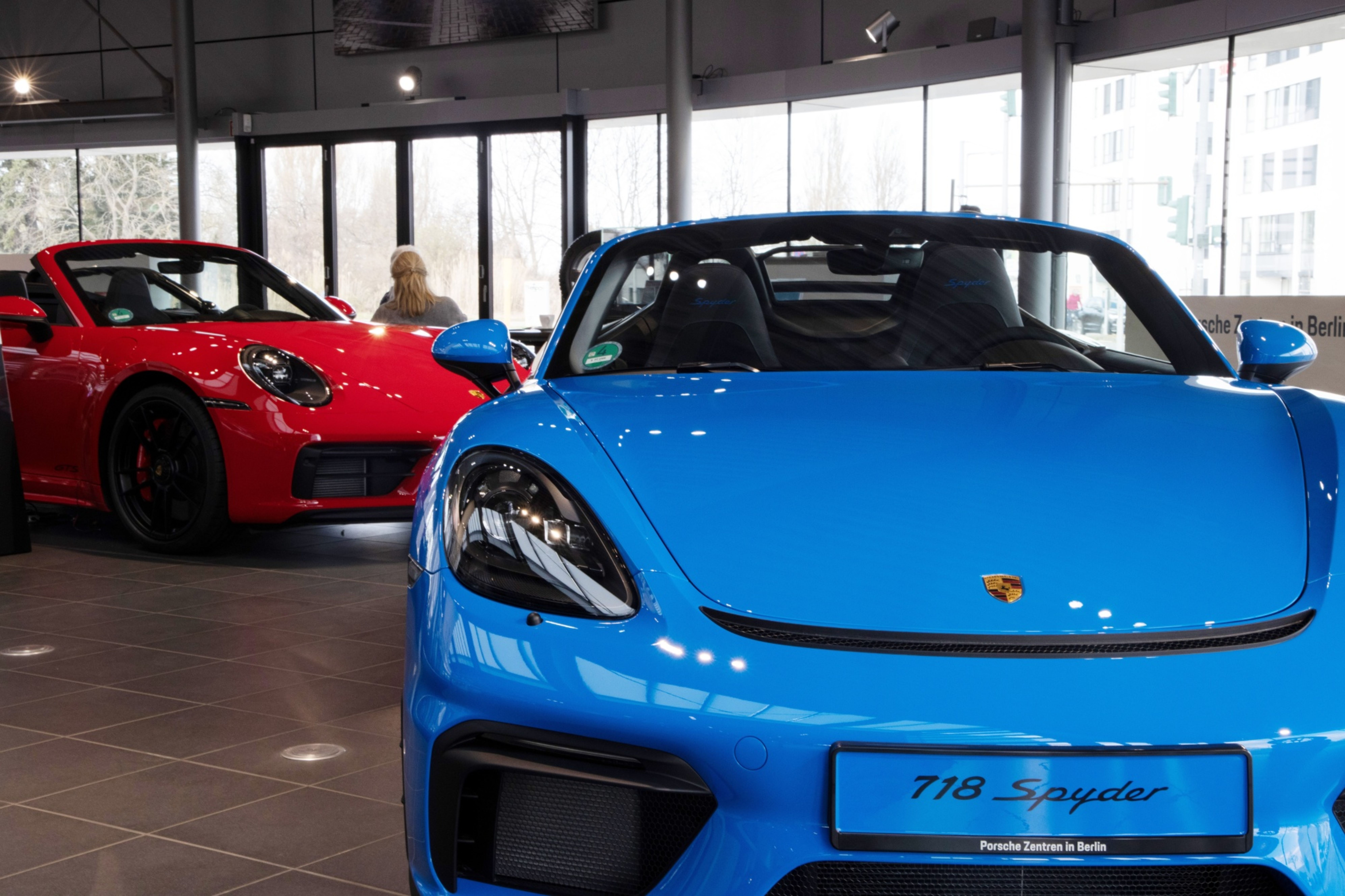 A Porsche 718 Spyder automobile at a Porsche SE showroom in Berlin, Germany, on Tuesday, March 29, 2022. Porsche, which reports reports final year earnings today, delivered 301,915 vehicles to customers in 2021, an 11% jump from 2020 and the first time it has surpassed the 300,000 mark.