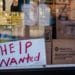 A "Help Wanted" sign outside a restaurant in the East Flatbush neighborhood in the Brooklyn borough of New York, U.S., on Monday, March 29, 2021.The U.S. economy is on a multi-speed track as minorities in some cities find themselves left behind by the overall boom in hiring, according to a Bloomberg analysis of about a dozen metro areas.