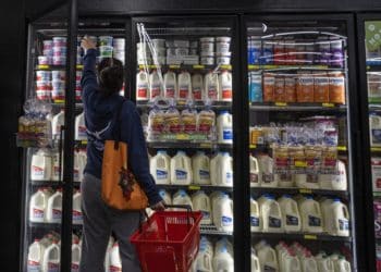 A shopper reaches for cottage cheese inside a grocery store in San Francisco, California, U.S., on Monday, May 2, 2022. U.S. inflation-adjusted consumer spending rose in March despite intense price pressures, indicating households still have solid appetites and wherewithal for shopping.