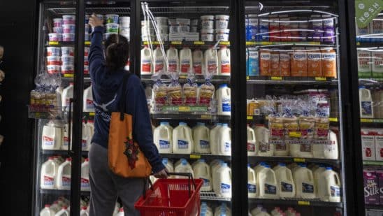 A shopper reaches for cottage cheese inside a grocery store in San Francisco, California, U.S., on Monday, May 2, 2022. U.S. inflation-adjusted consumer spending rose in March despite intense price pressures, indicating households still have solid appetites and wherewithal for shopping.