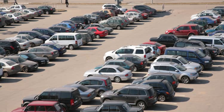 cars lined up in parking lot aerial view