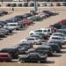 cars lined up in parking lot aerial view