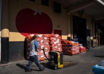 A worker at a wholesale produce market in the Union Market district in Washington, D.C.. Photographer: Al Drago/Bloomberg
