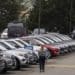 A salesperson walks on the lot of a Ford Motor Co. dealership in Colma, California, U.S., on Wednesday, June 30, 2021. With dwindling inventory over the last three months, U.S. auto sales has taken a sharp turn for the worse. Photographer: David Paul Morris/Bloomberg