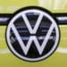The badge of a Volkswagen ID Buzz electric microbus at the Volkswagen AG (VW) multipurpose and commercial vehicle plant in Hannover, Germany, on Thursday, June 16, 2022. Europe's biggest automaker is set to become the world's biggest electric-car maker, inching past rival Tesla Inc. by 2024, according to Bloomberg Intelligence.